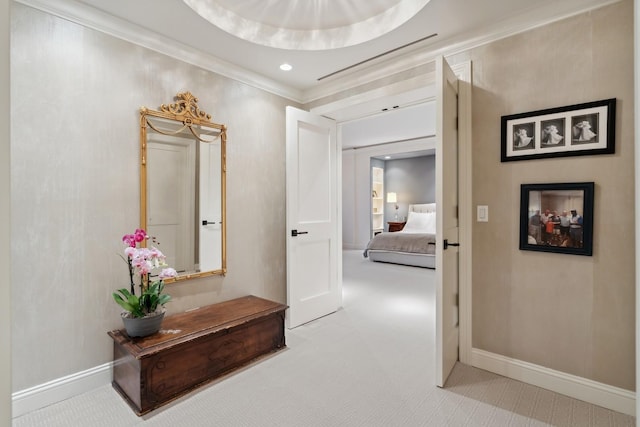 hall with ornamental molding, baseboards, carpet, and recessed lighting