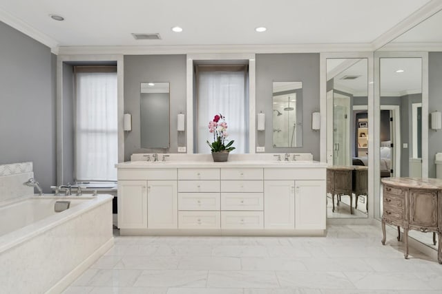 full bath with ornamental molding, marble look tiles, a stall shower, double vanity, and a garden tub