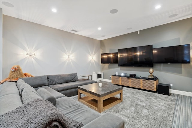 living room with baseboards and recessed lighting