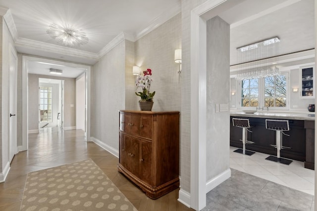 corridor featuring ornamental molding and baseboards