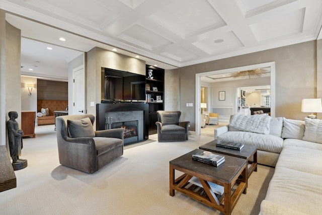 carpeted living area with ornamental molding, a fireplace, recessed lighting, coffered ceiling, and beamed ceiling