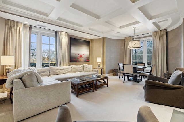 living room featuring coffered ceiling, beam ceiling, baseboards, light colored carpet, and crown molding
