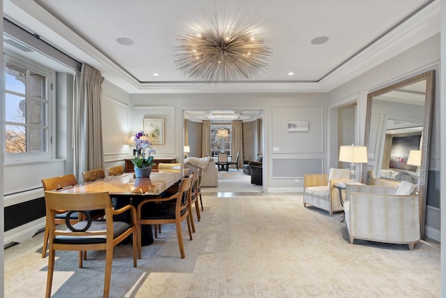 dining area featuring a decorative wall and ornamental molding