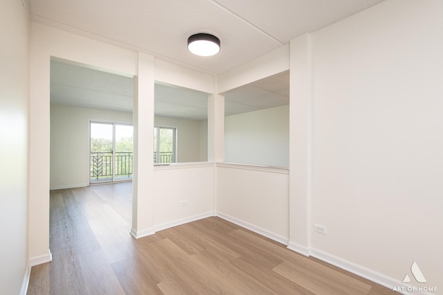 3940 W Bryn Mawr Ave Unit 403, Chicago, IL 60659 - empty room featuring wood finished floors and baseboards