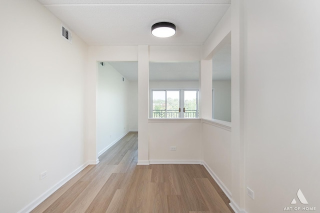 3940 W Bryn Mawr Ave Unit 403, Chicago, IL 60659 - spare room with wood finished floors and baseboards