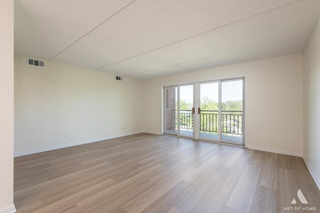 3940 W Bryn Mawr Ave Unit 403, Chicago, IL 60659 - unfurnished room featuring light wood-style floors and baseboards