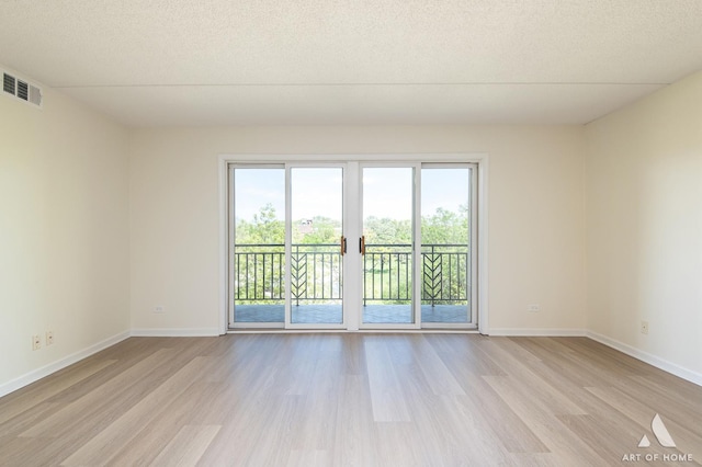 3940 W Bryn Mawr Ave Unit 403, Chicago, IL 60659 - empty room featuring light wood-style floors and baseboards