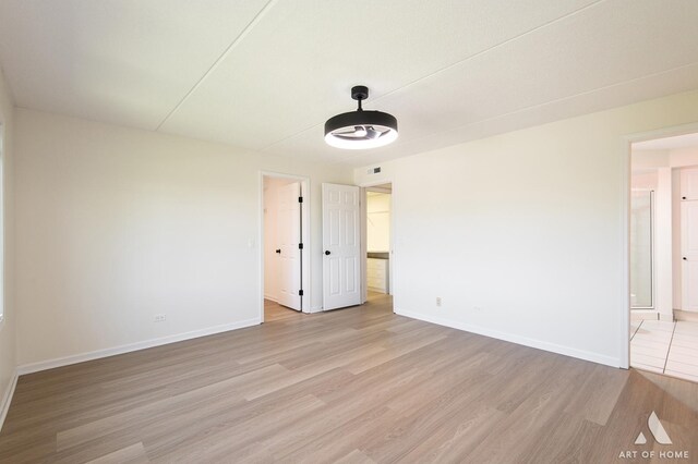 3940 W Bryn Mawr Ave Unit 403, Chicago, IL 60659 - empty room featuring light wood finished floors and baseboards