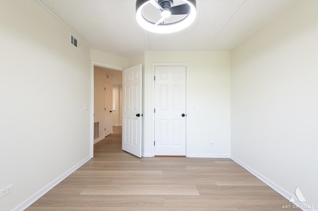 3940 W Bryn Mawr Ave Unit 403, Chicago, IL 60659 - empty room with light wood-style floors and baseboards