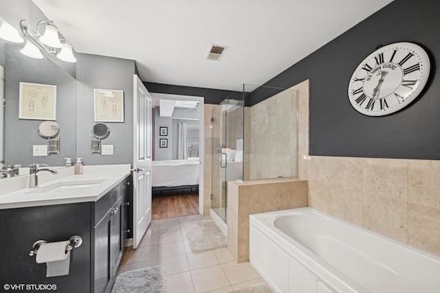 437 W N Ave Unit 404, Chicago, IL 60610 - full bathroom with a stall shower, vanity, a bath, tile patterned flooring, and connected bathroom