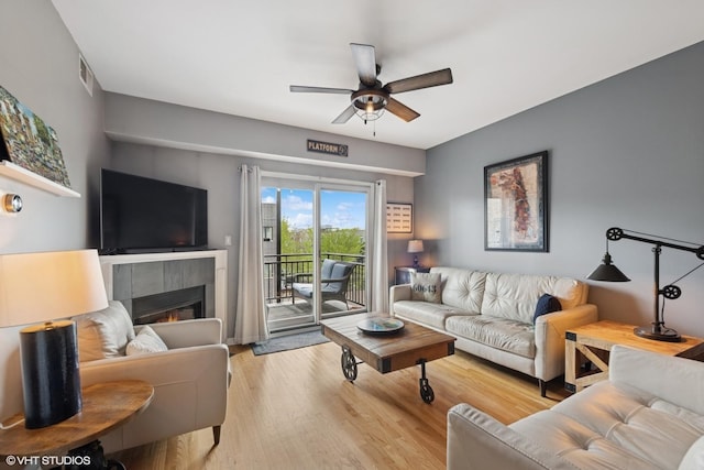 437 W N Ave Unit 404, Chicago, IL 60610 - living area featuring ceiling fan, wood finished floors, and a fireplace