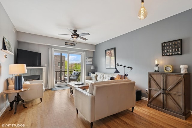 437 W N Ave Unit 404, Chicago, IL 60610 - living room with ceiling fan, wood finished floors, and a fireplace