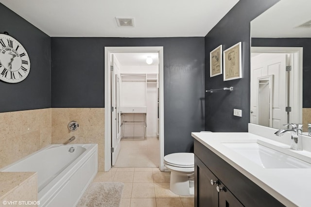 437 W N Ave Unit 404, Chicago, IL 60610 - bathroom featuring vanity, a garden tub, tile patterned flooring, and a walk in closet