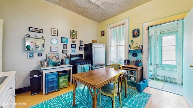 1655 N Francisco Ave, Chicago, IL 60647 - dining area featuring light wood finished floors