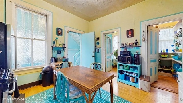 1655 N Francisco Ave, Chicago, IL 60647 - dining space with hardwood / wood-style flooring and healthy amount of natural light