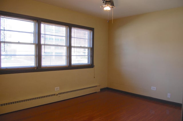 1001 N Harlem Ave Unit A, Oak Park, IL 60302 - unfurnished room with a baseboard radiator, a ceiling fan, wood finished floors, and baseboards