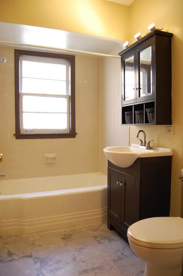 1001 N Harlem Ave Unit A, Oak Park, IL 60302 - bathroom with toilet, marble look tile flooring, vanity, and plenty of natural light