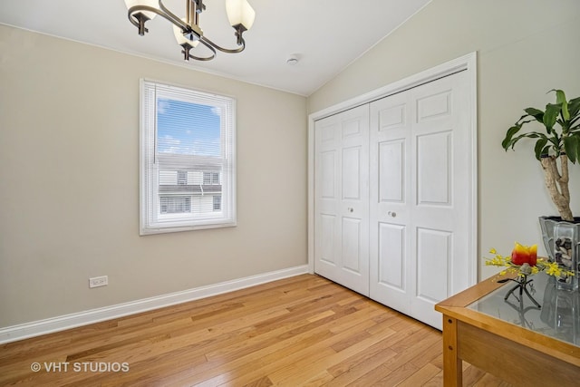 4101 N Ozark Ave, Norridge, IL 60706 - dining area featuring a chandelier, light wood-style flooring, and baseboards