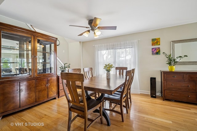 4101 N Ozark Ave, Norridge, IL 60706 - dining room with a ceiling fan, light wood-style flooring, and baseboards