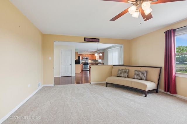 12809 W Meadowview Ln, Homer Glen, IL 60491 - living area with dark carpet, baseboards, and ceiling fan