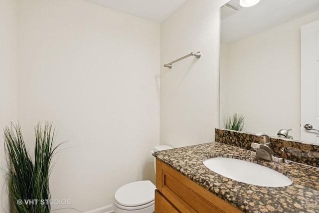 12809 W Meadowview Ln, Homer Glen, IL 60491 - half bathroom featuring vanity, toilet, and baseboards