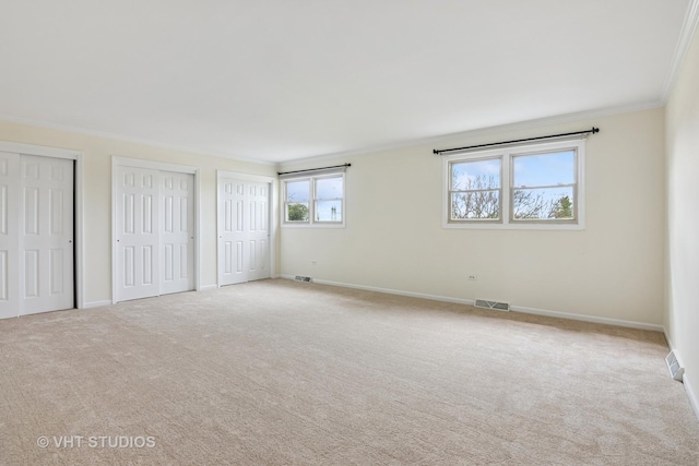 12809 W Meadowview Ln, Homer Glen, IL 60491 - unfurnished bedroom with ornamental molding, two closets, carpet flooring, and baseboards