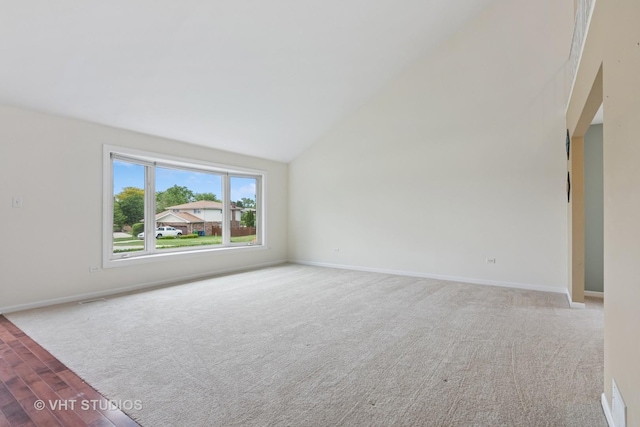 12809 W Meadowview Ln, Homer Glen, IL 60491 - empty room with lofted ceiling, carpet flooring, and baseboards