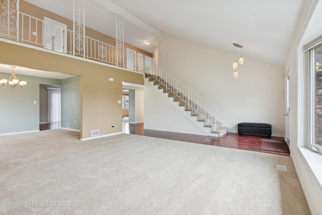 12809 W Meadowview Ln, Homer Glen, IL 60491 - unfurnished living room featuring carpet flooring, high vaulted ceiling, stairs, baseboards, and a chandelier