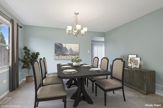 12809 W Meadowview Ln, Homer Glen, IL 60491 - dining area featuring a chandelier, healthy amount of natural light, light colored carpet, and baseboards