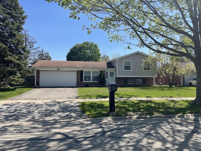 235 Lexington Dr, Bolingbrook, IL 60440 - split level home featuring driveway, a garage, and brick siding