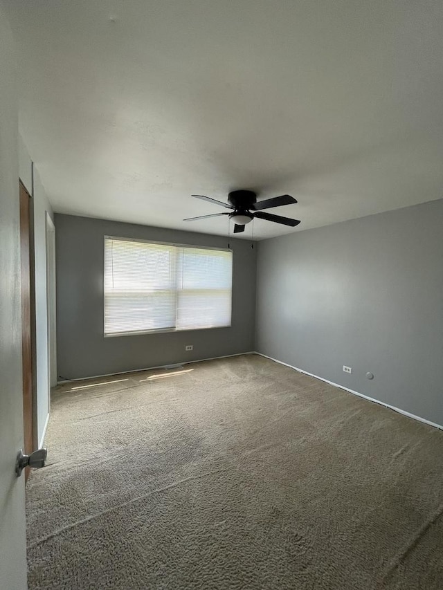 235 Lexington Dr, Bolingbrook, IL 60440 - unfurnished room featuring carpet floors, ceiling fan, and baseboards