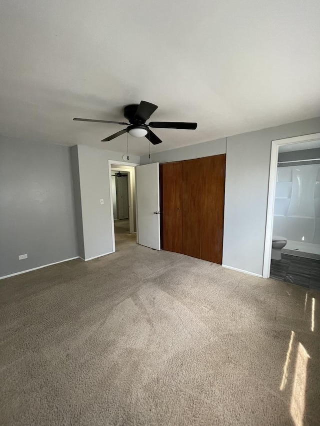 235 Lexington Dr, Bolingbrook, IL 60440 - unfurnished bedroom with carpet, a closet, ensuite bath, a ceiling fan, and baseboards