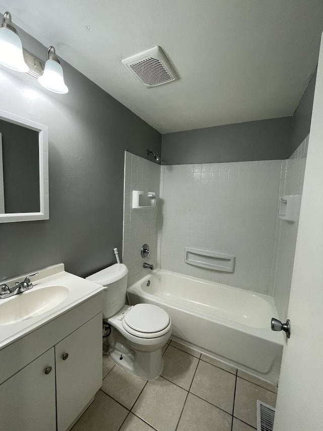 235 Lexington Dr, Bolingbrook, IL 60440 - bathroom with tile patterned flooring, toilet, washtub / shower combination, and vanity