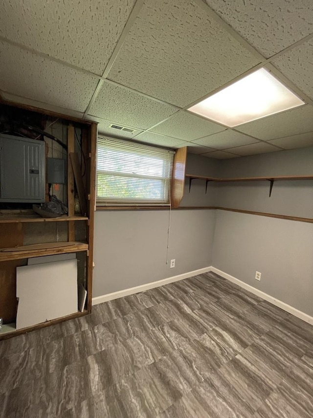 235 Lexington Dr, Bolingbrook, IL 60440 - below grade area featuring electric panel, a drop ceiling, and baseboards