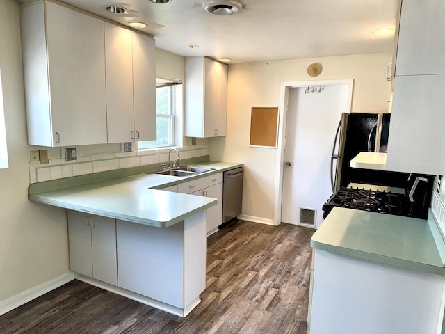 120 E 15th St, Lombard, IL 60148 - kitchen with a sink, appliances with stainless steel finishes, a peninsula, and dark wood finished floors