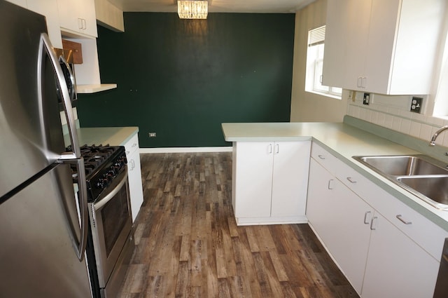 120 E 15th St, Lombard, IL 60148 - kitchen with stainless steel appliances, a sink, dark wood finished floors, and light countertops