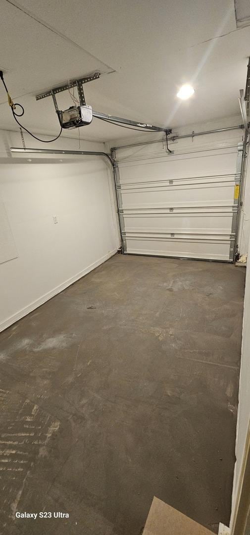 307 Bevier Pl, Aurora, IL 60505 - garage with a garage door opener and baseboards