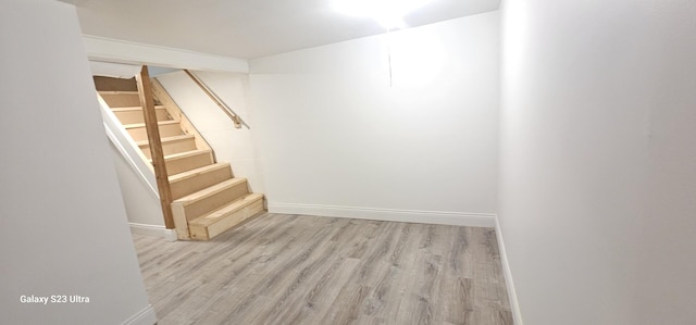 307 Bevier Pl, Aurora, IL 60505 - finished below grade area featuring stairway, wood finished floors, and baseboards