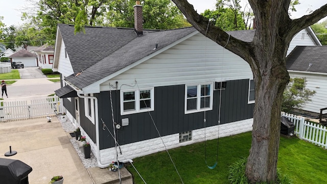 3728 216th St, Matteson, IL 60443 - view of home's exterior with roof with shingles, a chimney, and a gate