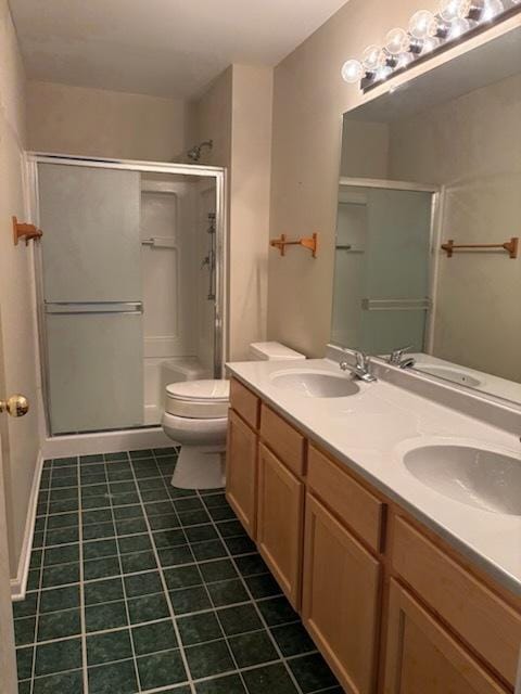 1127 N Red Oak Cir Unit 2, Round Lake Beach, IL 60073 - bathroom with tile patterned flooring, a shower stall, toilet, and double vanity