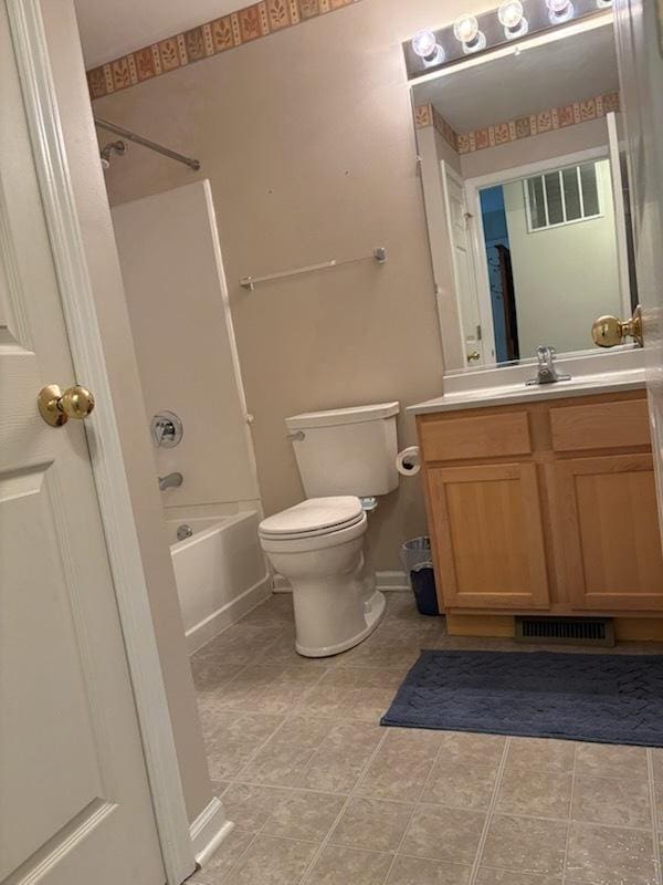 1127 N Red Oak Cir Unit 2, Round Lake Beach, IL 60073 - bathroom featuring toilet, shower / tub combination, vanity, tile patterned floors, and baseboards