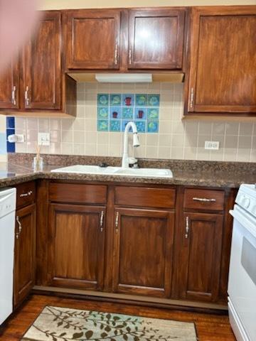 1127 N Red Oak Cir Unit 2, Round Lake Beach, IL 60073 - kitchen with a sink, stove, dishwasher, dark wood-style flooring, and dark stone countertops