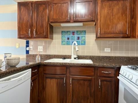 1127 N Red Oak Cir Unit 2, Round Lake Beach, IL 60073 - kitchen with white appliances, a sink, backsplash, and dark stone countertops