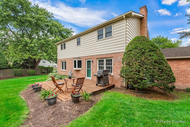 570 E Carpenter Dr, Palatine, IL 60074 - back of house with a chimney, a wooden deck, and brick siding