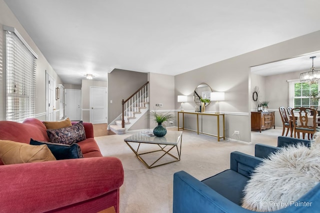 570 E Carpenter Dr, Palatine, IL 60074 - carpeted living area featuring stairway and a chandelier