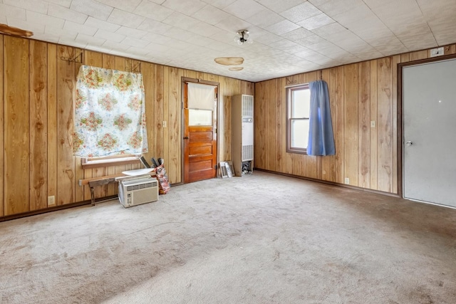 empty room with wooden walls and carpet