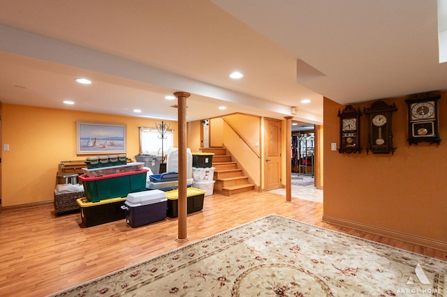 living area featuring wood finished floors, stairway, baseboards, and recessed lighting