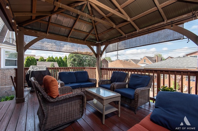 deck featuring outdoor lounge area and a gazebo