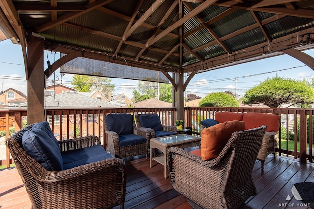 deck featuring an outdoor living space and a gazebo