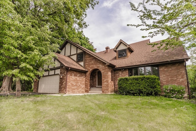 5N683 Ravine Dr, Saint Charles, IL 60175 - tudor-style house with brick siding, a front lawn, and a shingled roof
